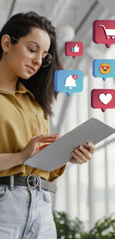 Marketer working on a tablet with social media reactions